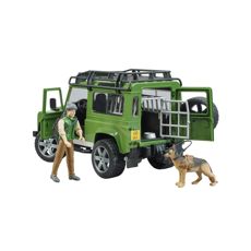 Land Rover Defender Stationsvagn med skog och hund